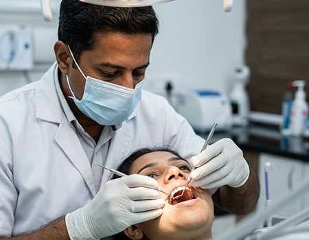 Painless root canal treatment to save infected teeth in Coimbatore clinic.